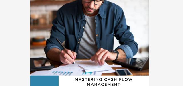 A man sitting at his desk, working on his cash flow analysis.