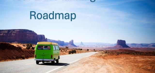 An old green pop-top van driving down an empty desert road on a clear sunny day. The words "Your Exit Planning Roadmap" in text over the sky.
